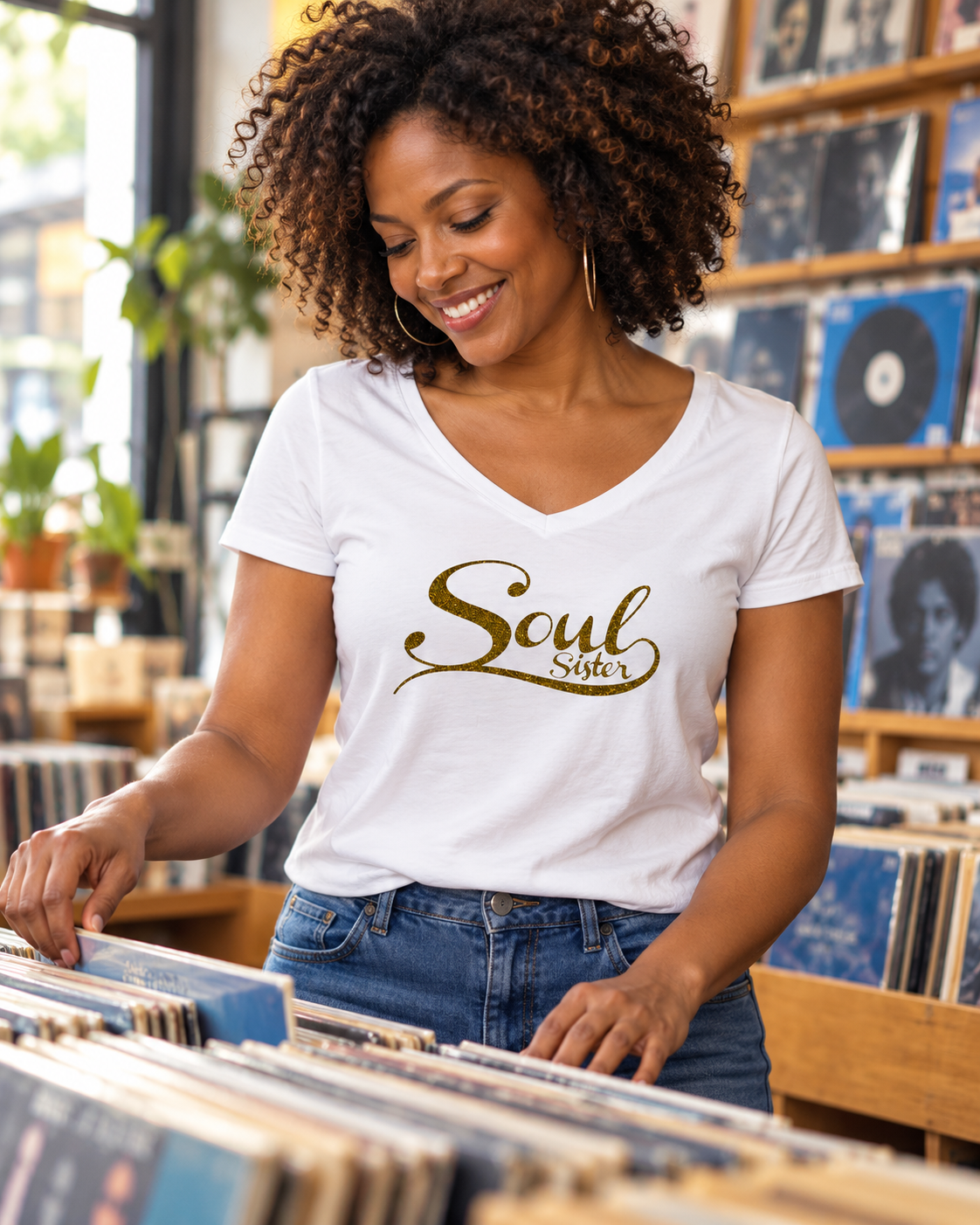 Woman wearing a white Soul Sister T-shirt in a record shop